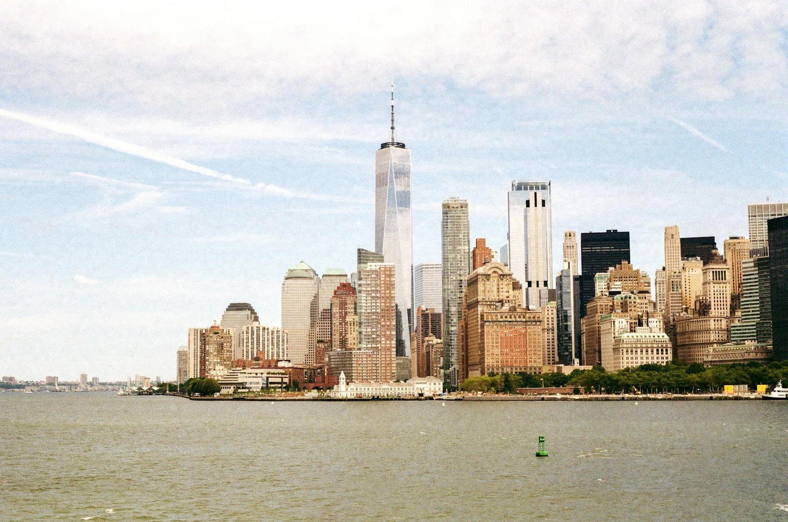 View of Lower Manhattan and One World Trade Center from across the water