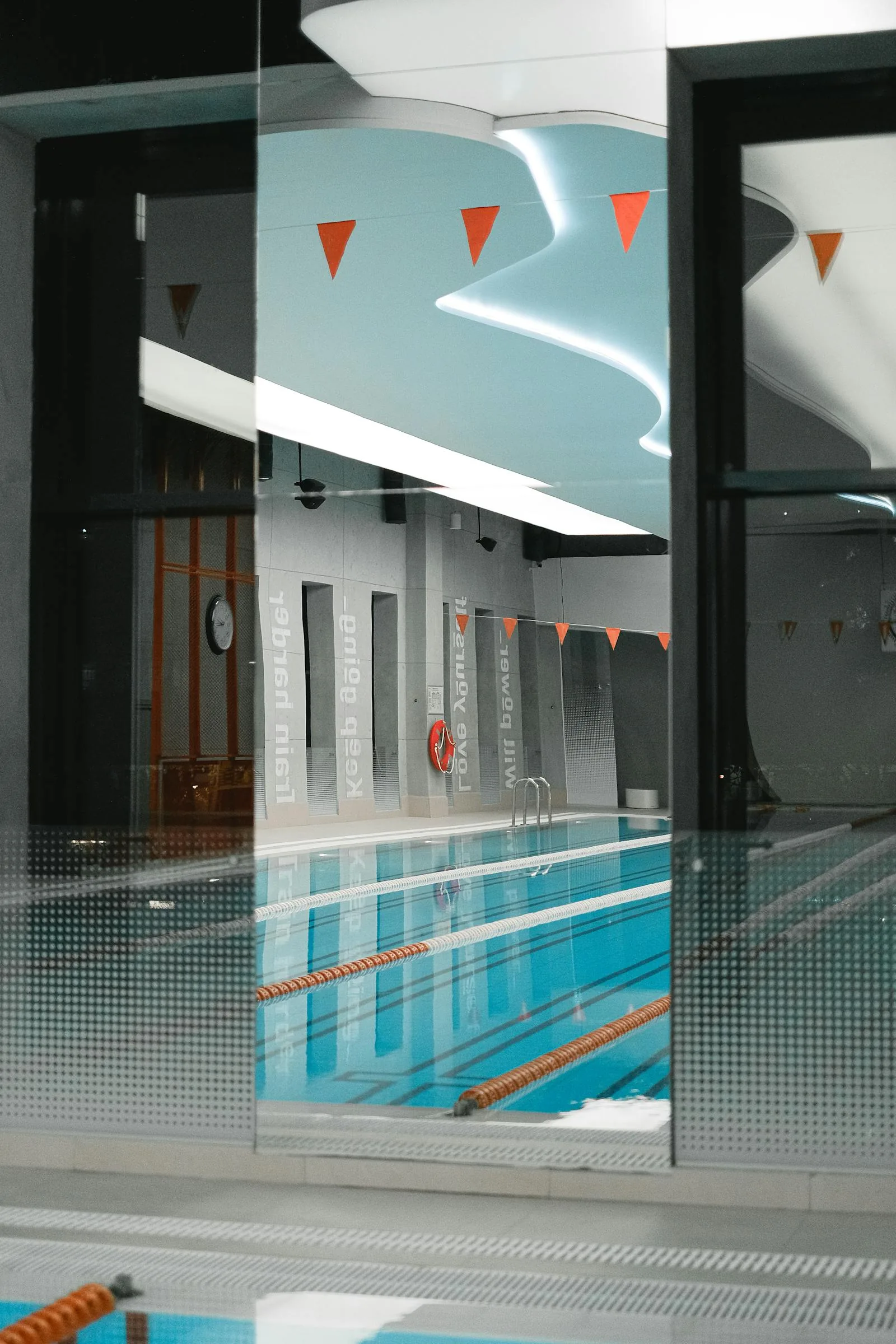 Indoor leisure centre swimming pool with wave machine and flume in Essex UK