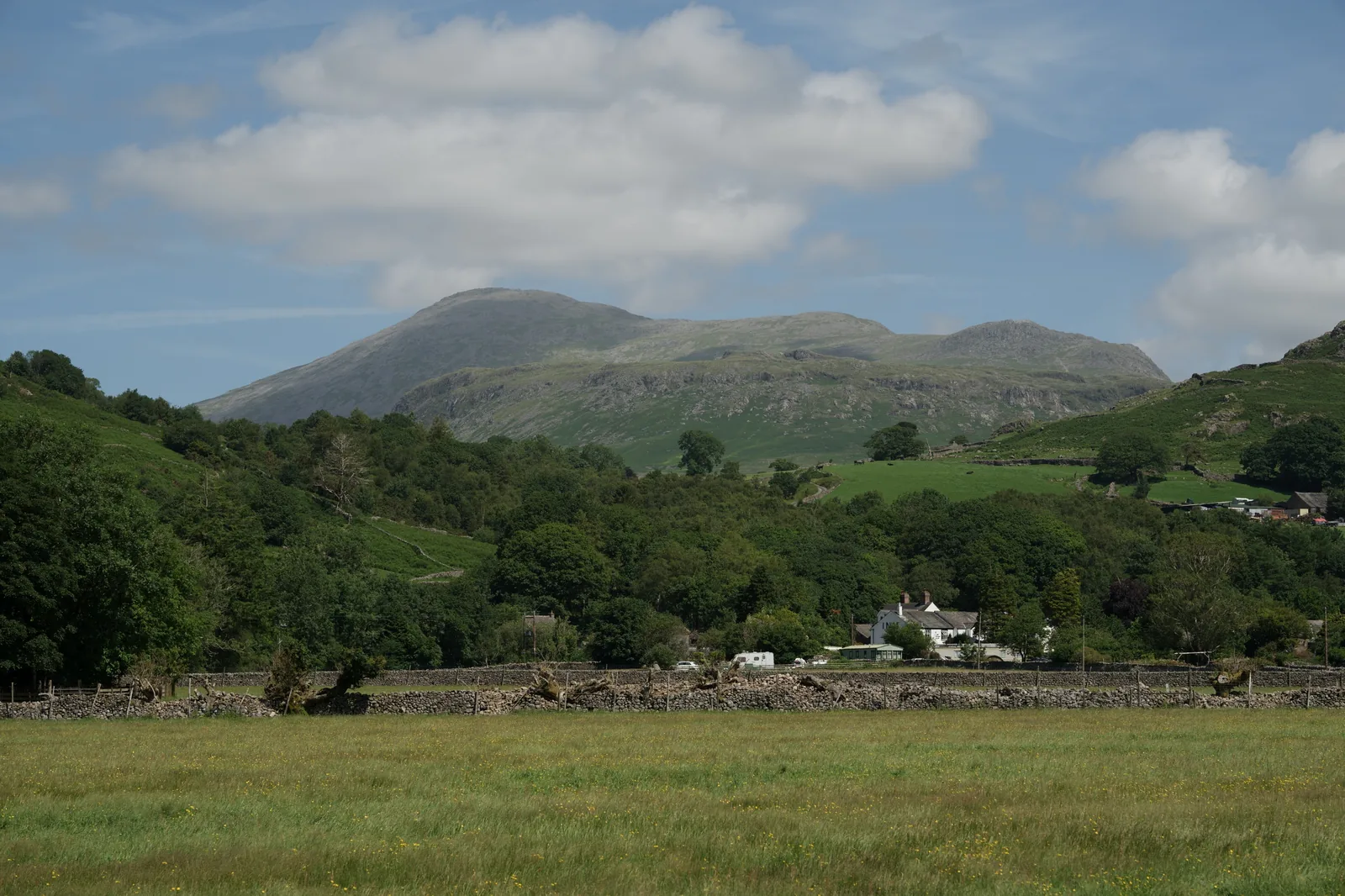 Boot village in the Eskdale valley with Scafell Pike mountain range behind