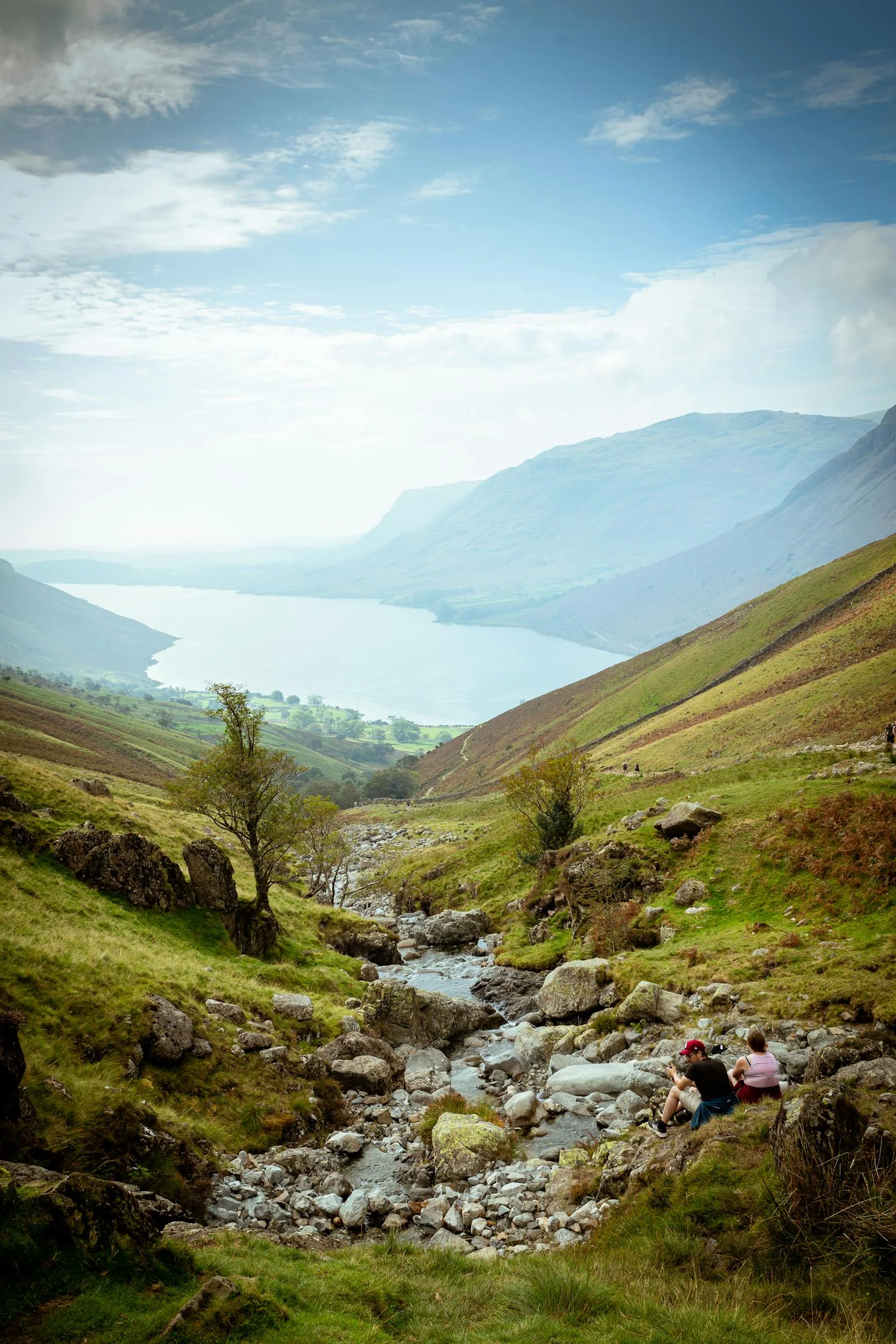 Rocky stream flowing down Wasdale valley with Wastwater lake visible between the Lake District fells