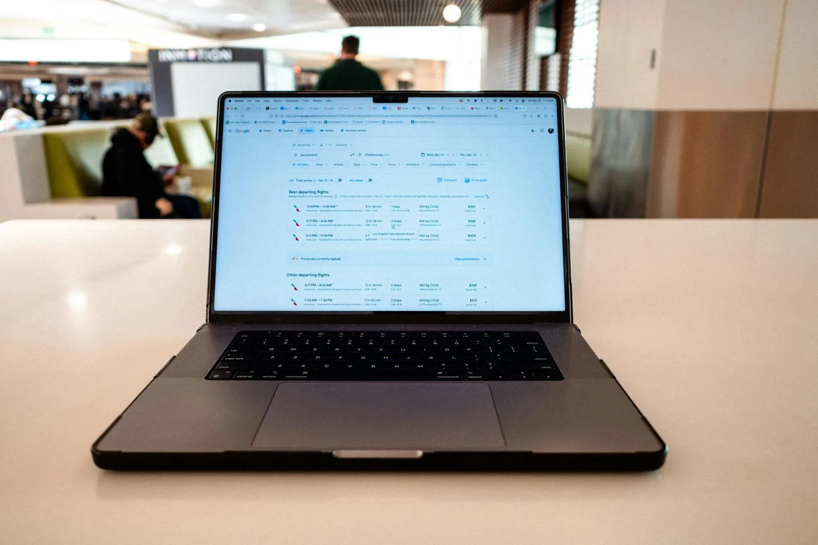 Laptop showing flight schedules for travel booking and holiday planning