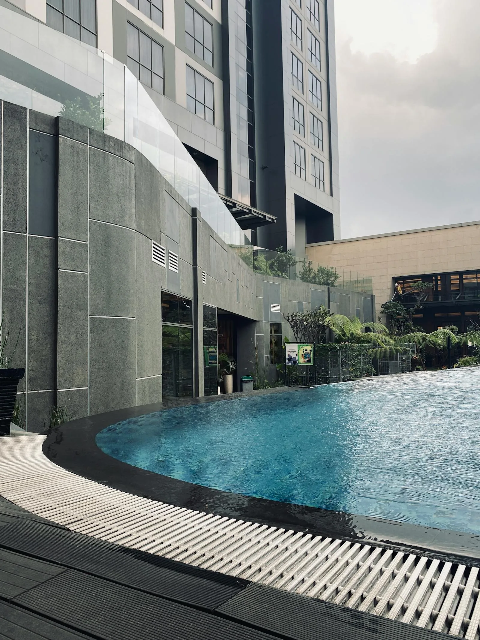 Luxury hotel poolside retreat showing room access to pool