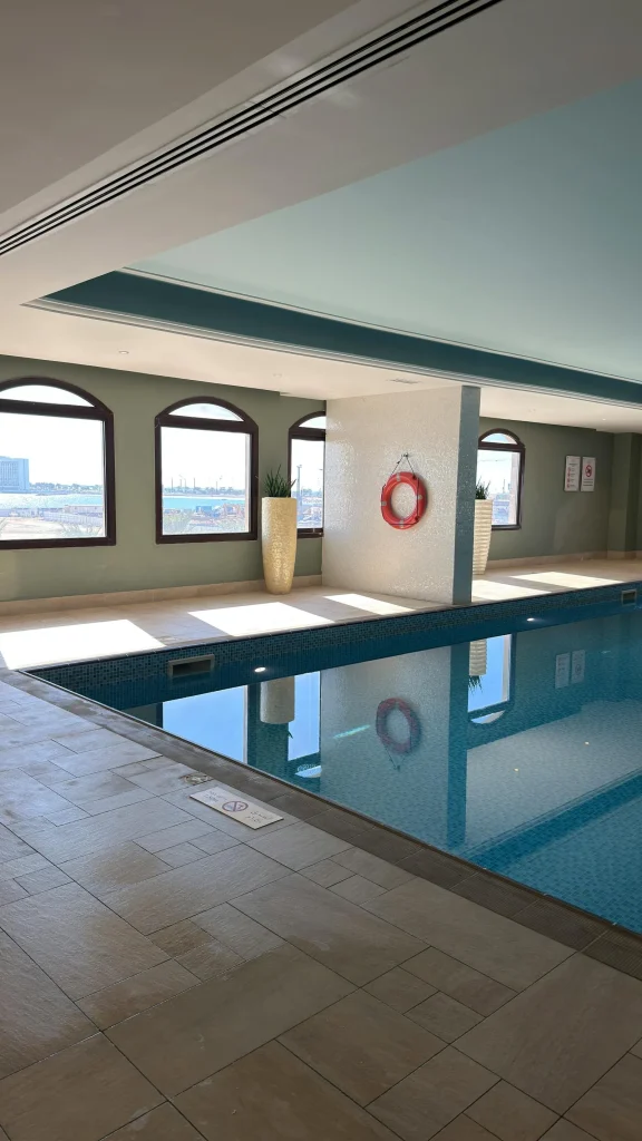 Luxury hotel indoor swimming pool with mood lighting in Bristol city centre