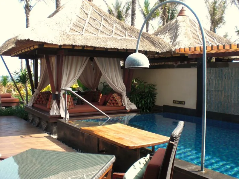 Private infinity pool villa at a Bali hotel resort surrounded by tropical gardens