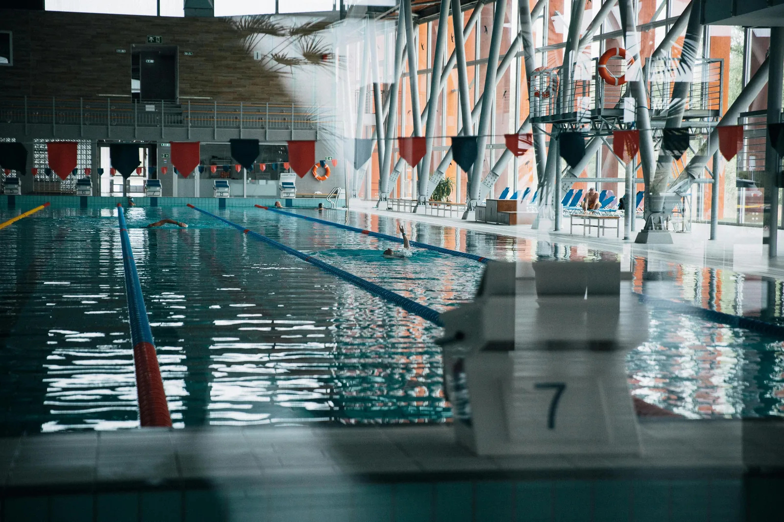 Swimmers in an indoor pool at a UK leisure centre