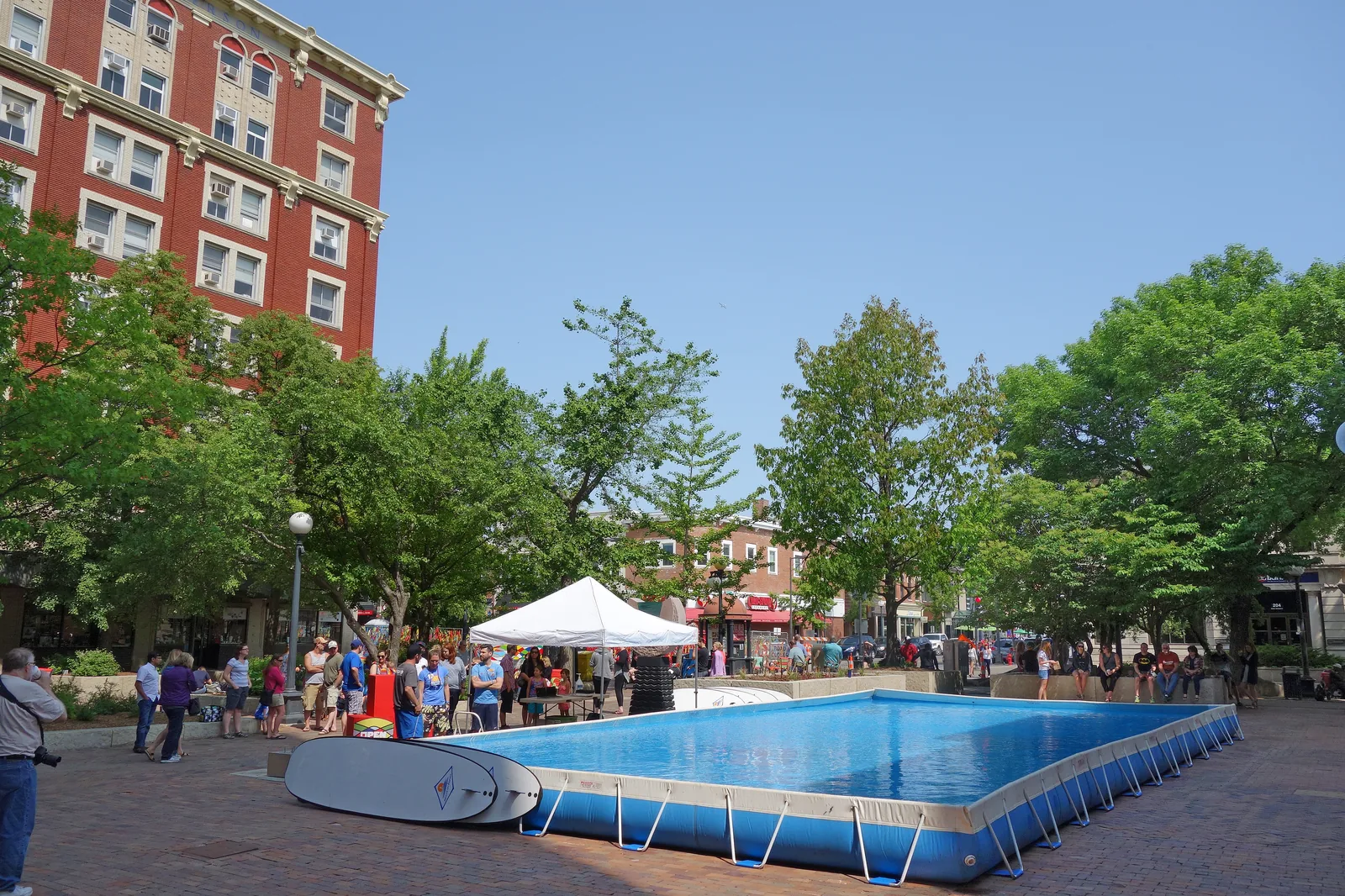 Large rectangular blue metal frame above-ground pool set up outdoors