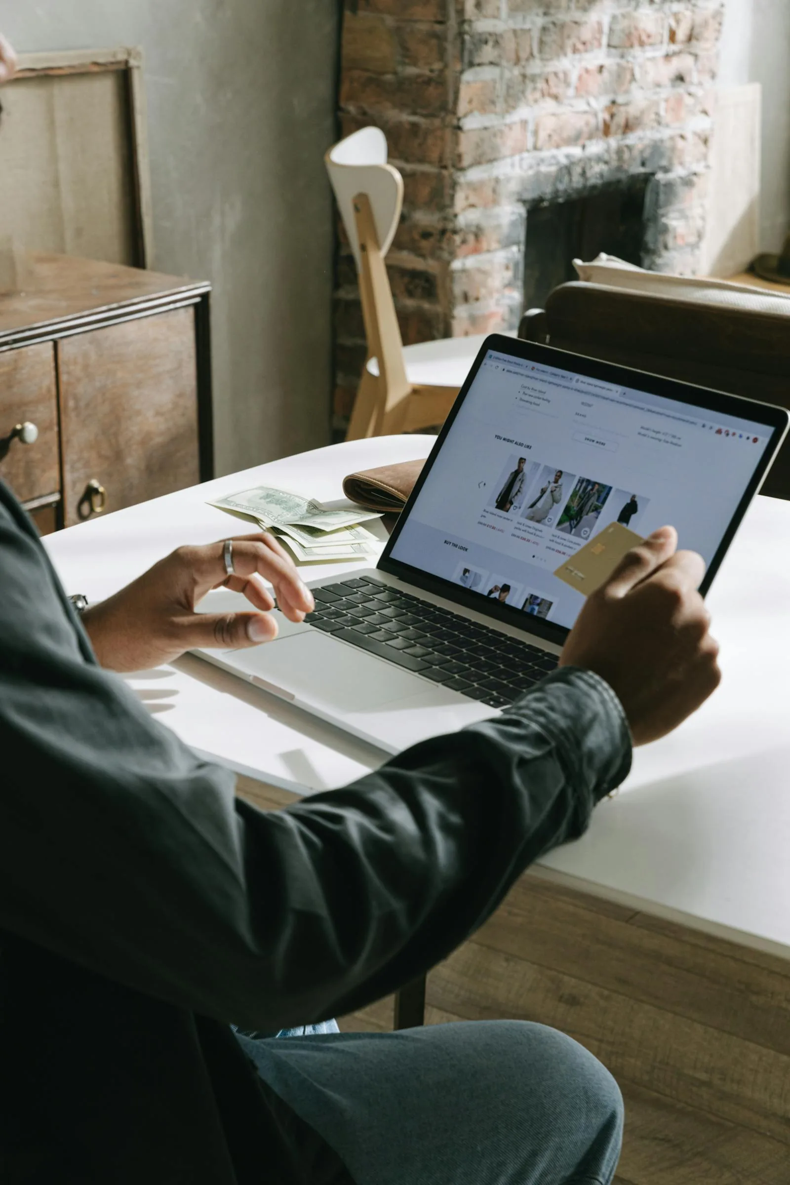 Person using a laptop and credit card to book a private hydrotherapy pool session online