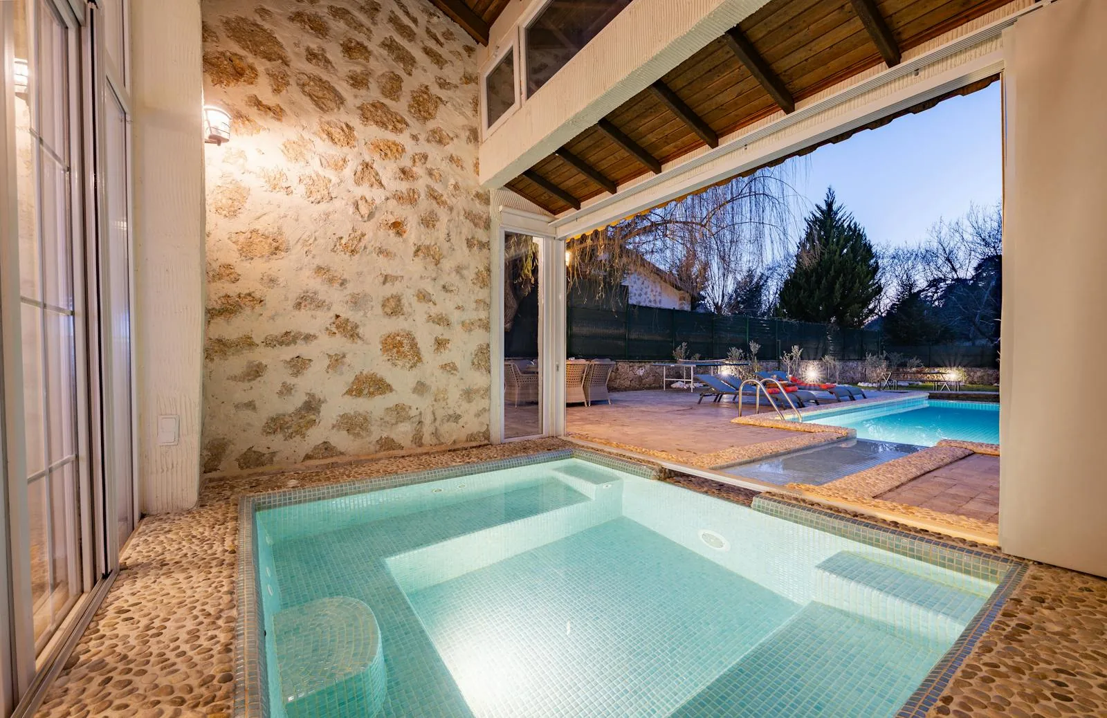 Private indoor hydrotherapy pool venue with tiled walls and gradual entry