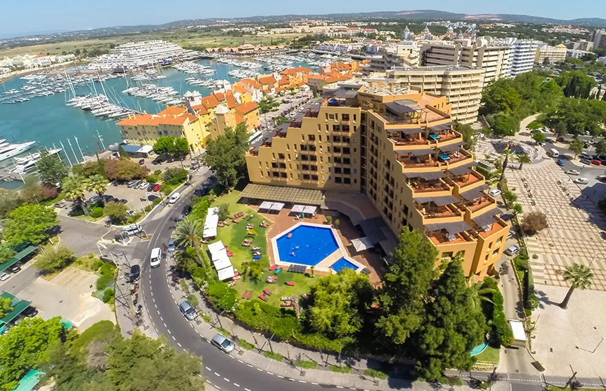 Aerial view of the Dom Pedro Marina hotel with outdoor pool overlooking Vilamoura marina, Algarve