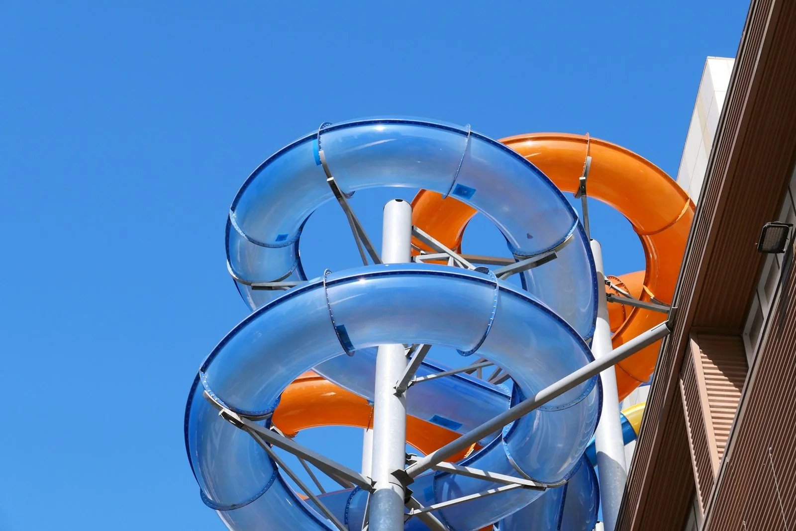 Blue and orange tube water slides at a UK water park showing typical slide structure