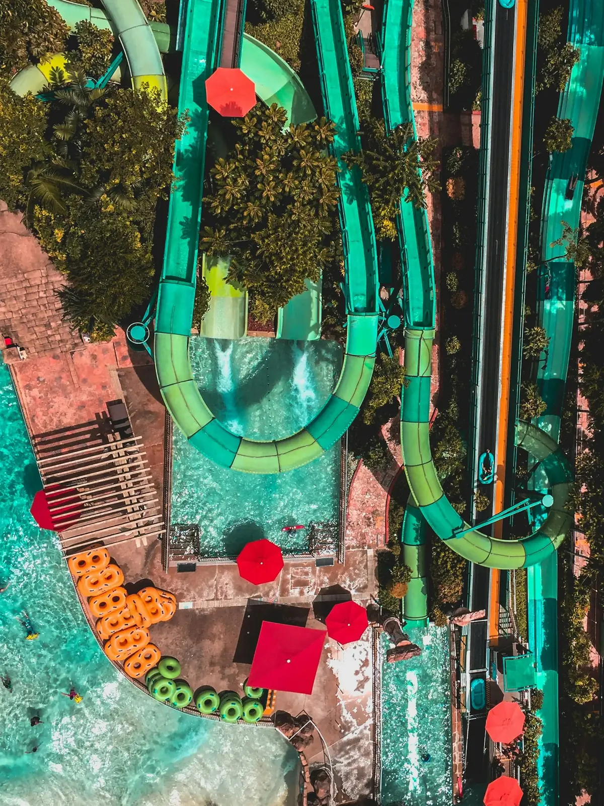 Aerial view of a large water park with multiple water slides and pools showing scale of UK water parks