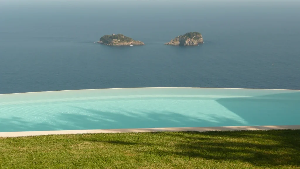 Infinity pool at Villa Miragalli on the Amalfi Coast overlooking the Tyrrhenian Sea with two rocky islands
